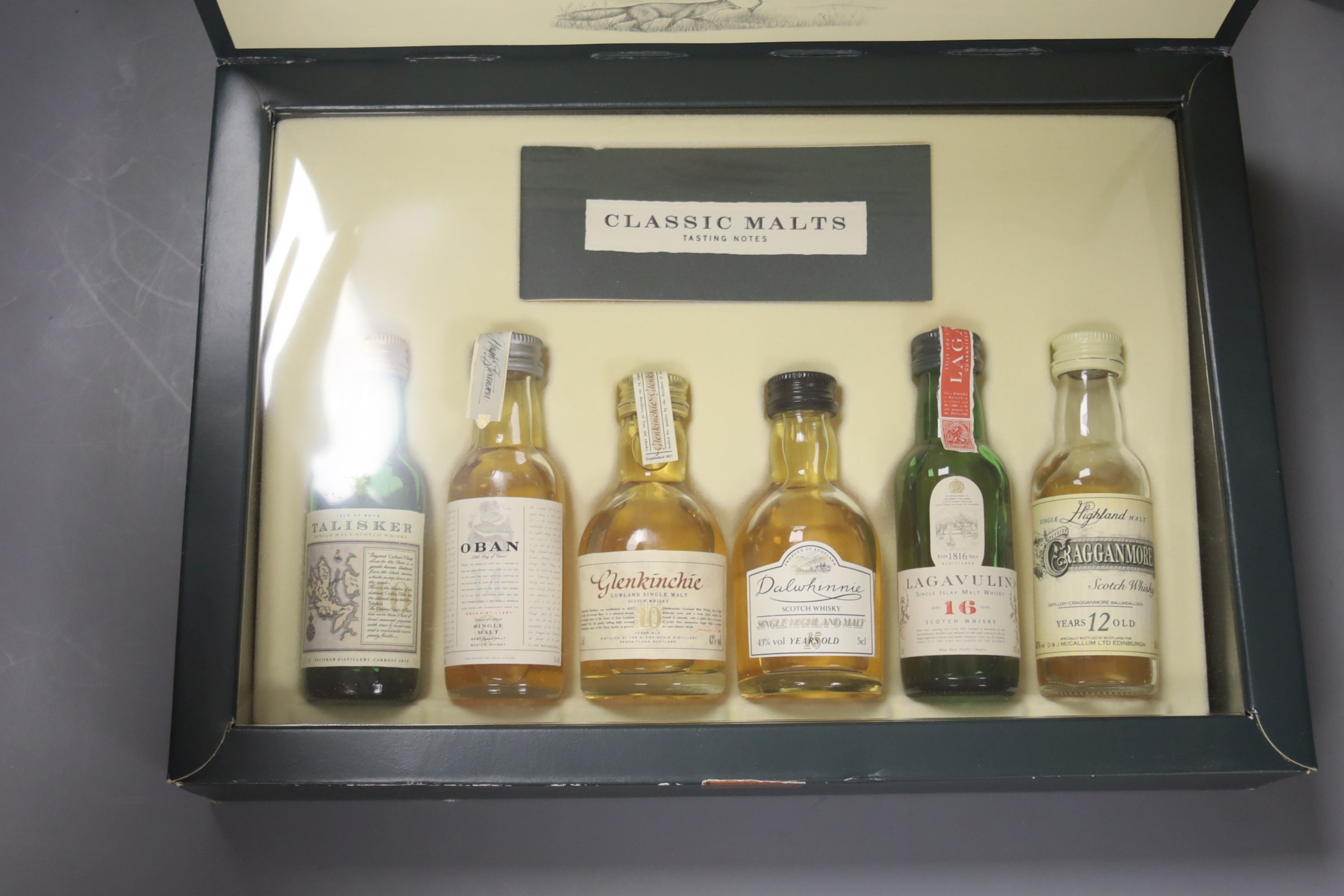 One bottle of Macallan select oak, a boxed Invergordon singles bar and similar classic malts